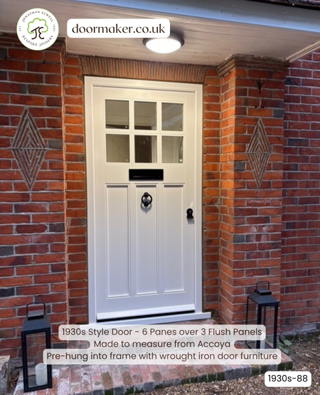 white 6 pane over 3 panel 1930s door and frame with black ironmongery