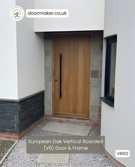 oak contemporary entrance door with vertical boards and long black pull handles