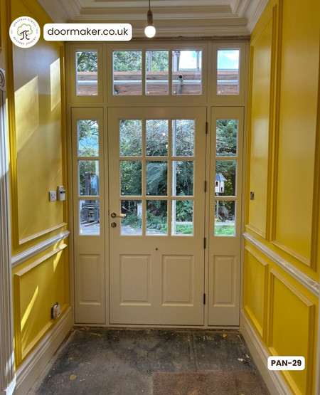 Yellow front door panelled door made from Accoya white inside, traffic yellow outside