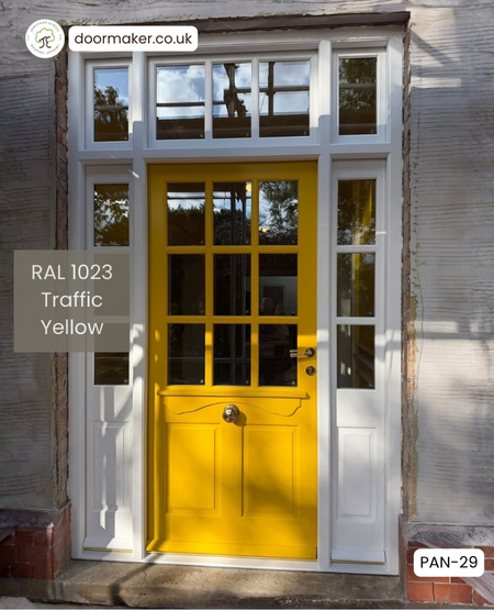 yellow period front door and frame with toplight and sidelights