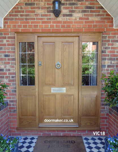 victorian front door with side panels made from oak