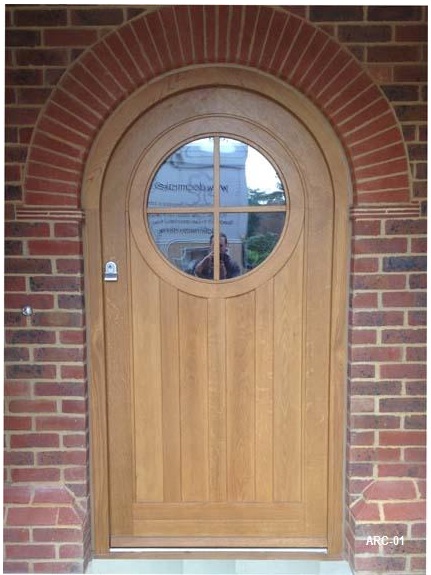 oak arched door round window vision panel