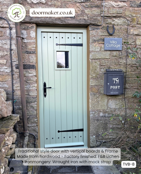 traditional cottage style door with studs and mock hinges painted lichen