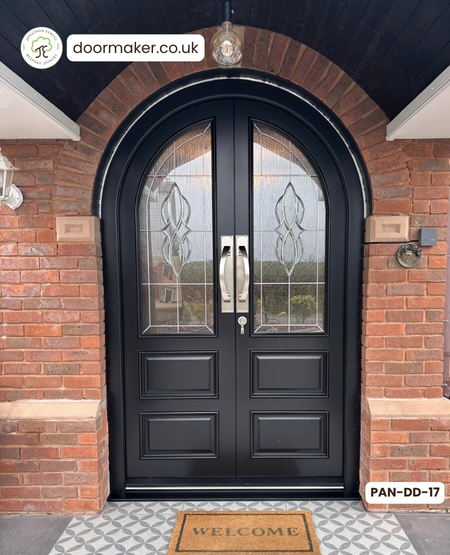 bespoke arched double doors made from Accoya 1 decorative glazed pane over 2 raised and fielded panels 